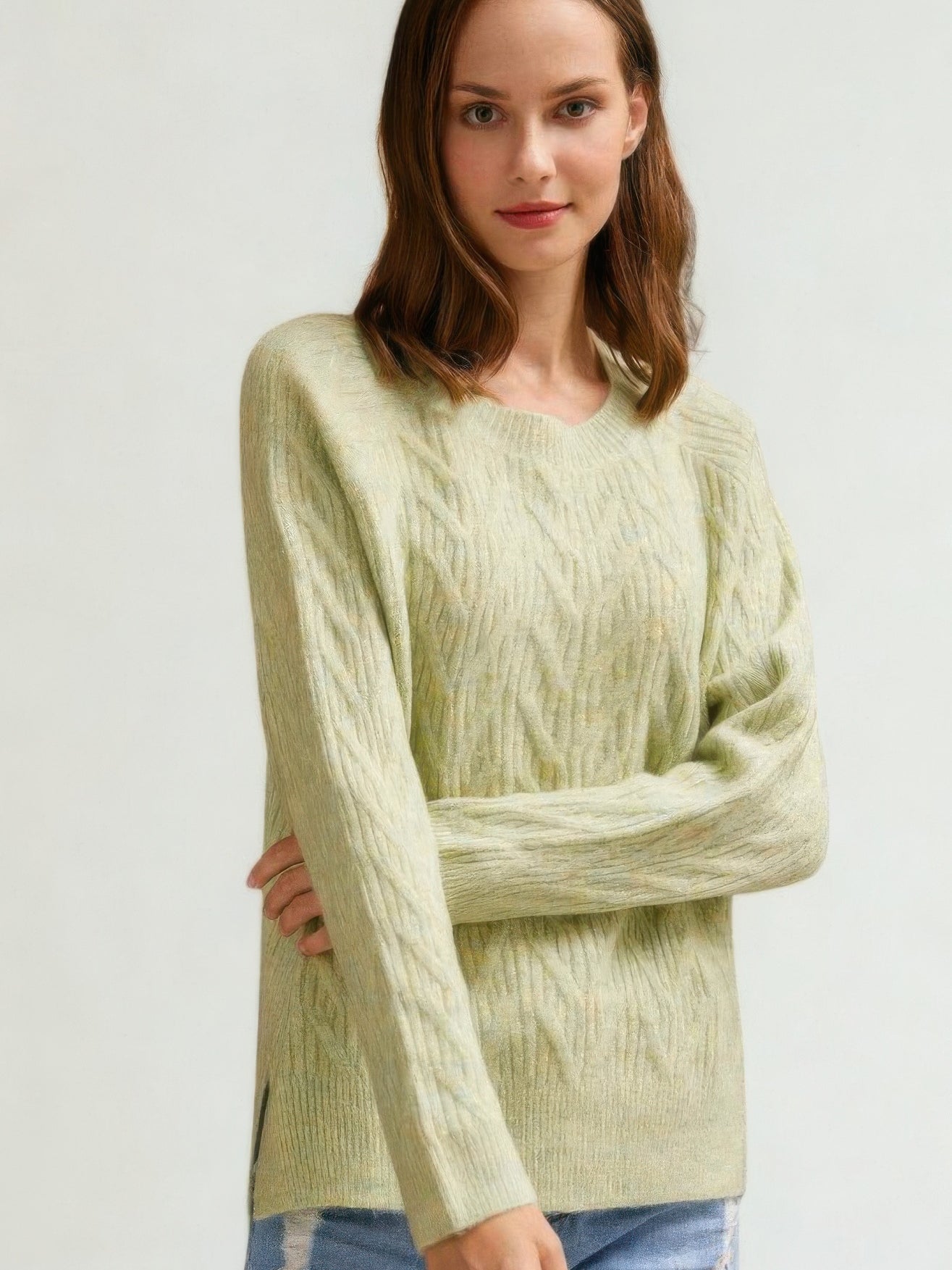 The Maple Braided Cable Sweater in light green, detail view