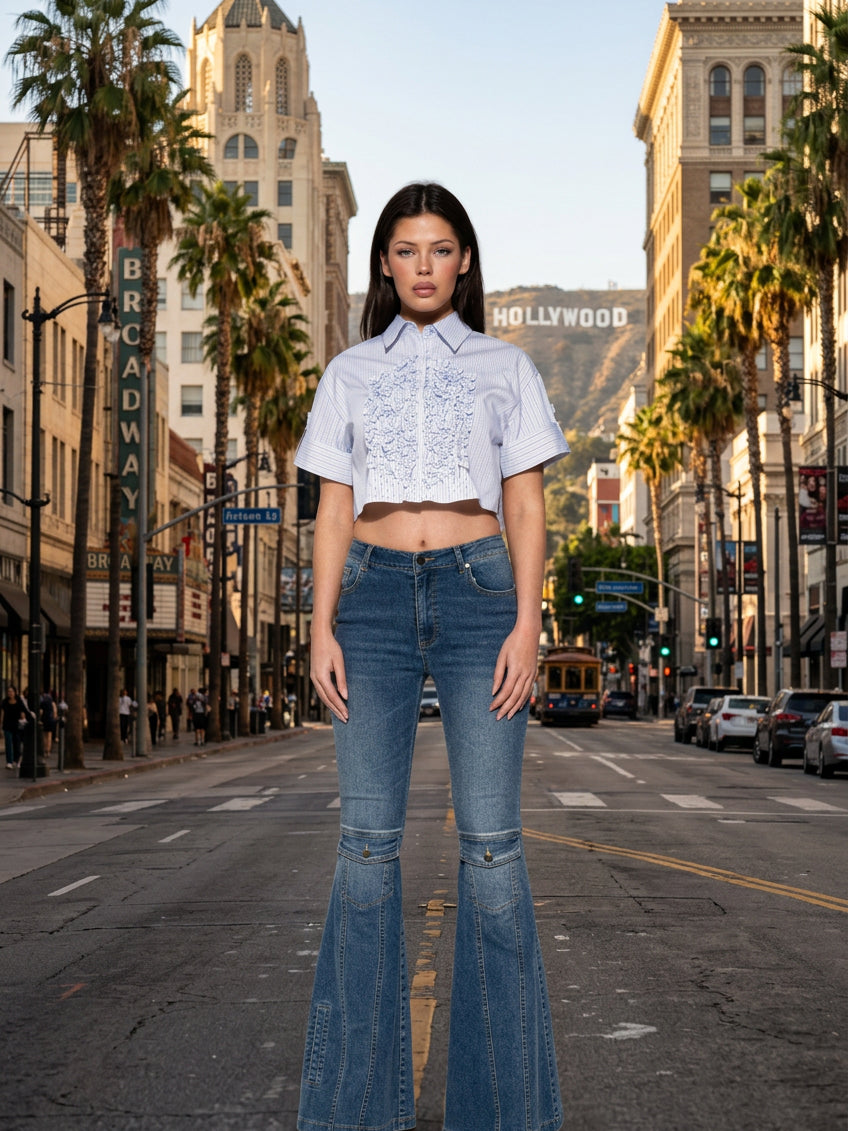 Model wearing The Signal Panel Flare Jean featuring panel-stitched flare extensions and high-rise waist.