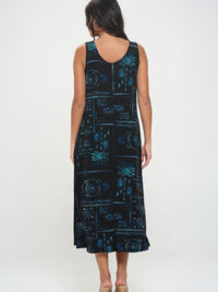 Back view of a model wearing a stylish plus size long dress with a unique pattern and relaxed fit.