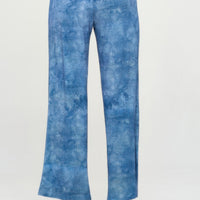 Back view of Elastic Waistband Flared Pants in blue denim print, featuring a comfortable elastic waistband.