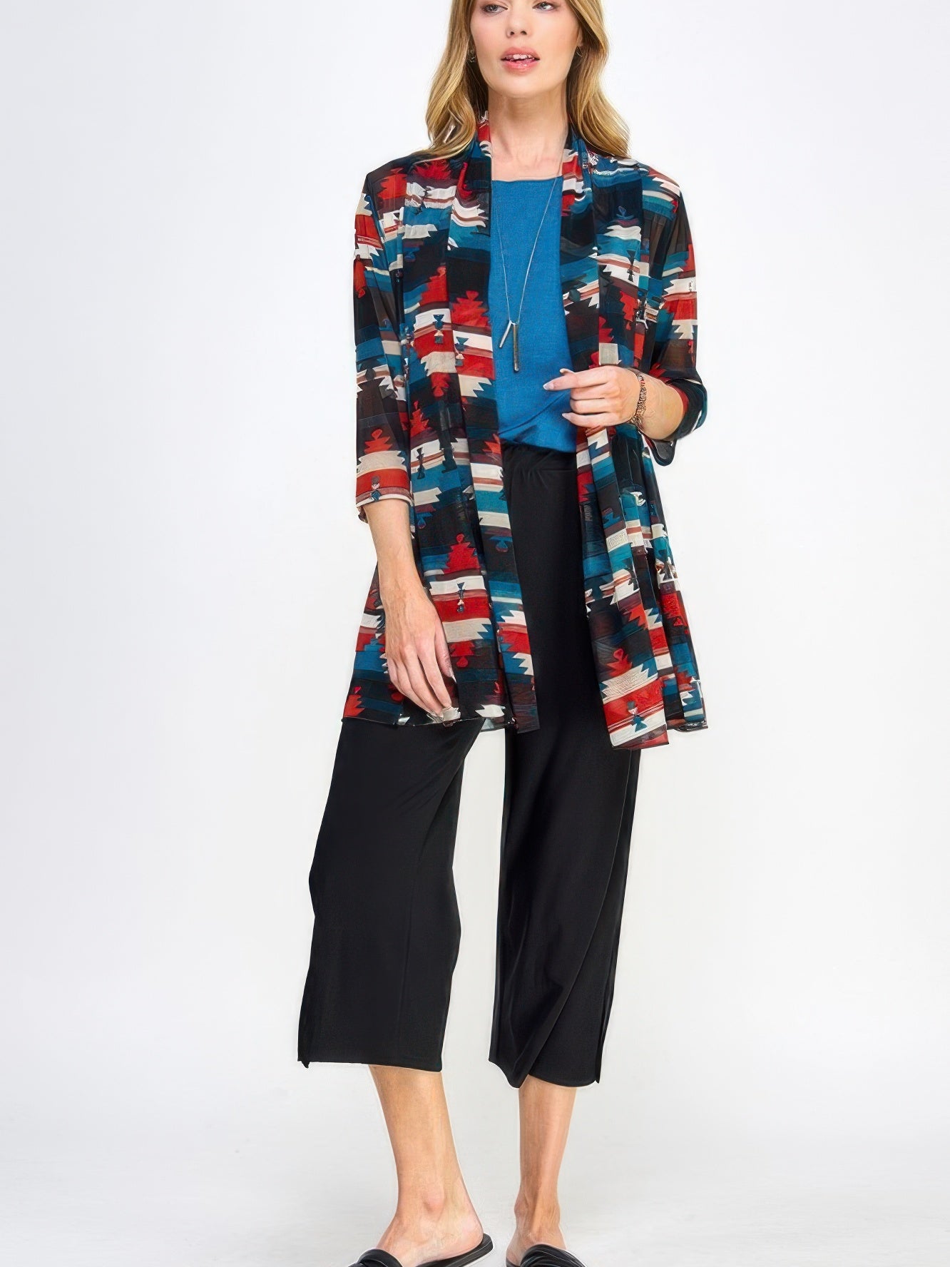 Model wearing Mr Princess Jacket with a colorful pattern, paired with a blue top and black pants, showcasing versatile fashion.