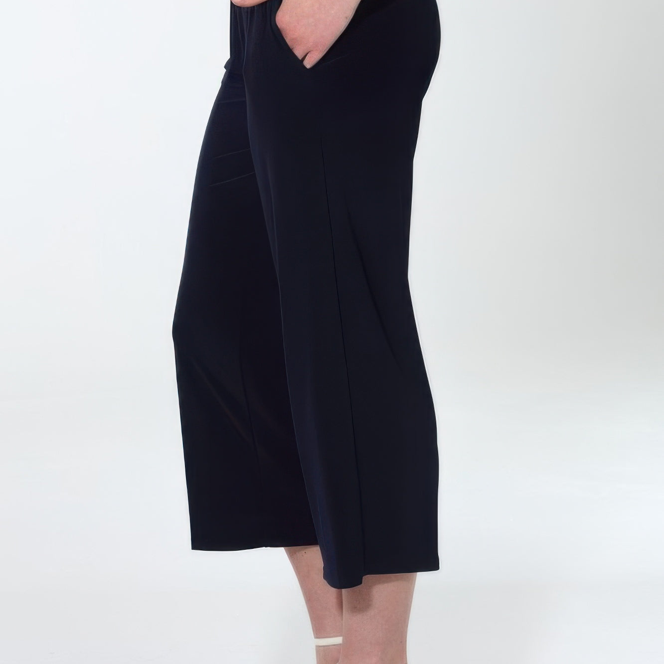 Hit Wide Leg Ankle Length Pants model showcasing side view with pockets and a relaxed fit.