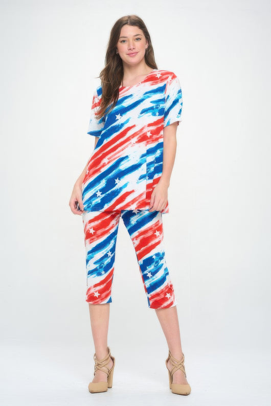 Model wearing Short Sleeve Top Capri Pants Set in red, white, and blue print, perfect for summer lounging.