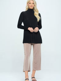 BNS Mock Turtle Neck Top worn with stylish cropped pants, showcasing a sleek silhouette and comfortable fit.