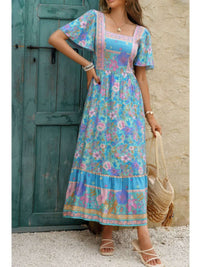Square Neck Boho Floral A Line Fit Dress showcased against a rustic door backdrop, perfect for summer outings.