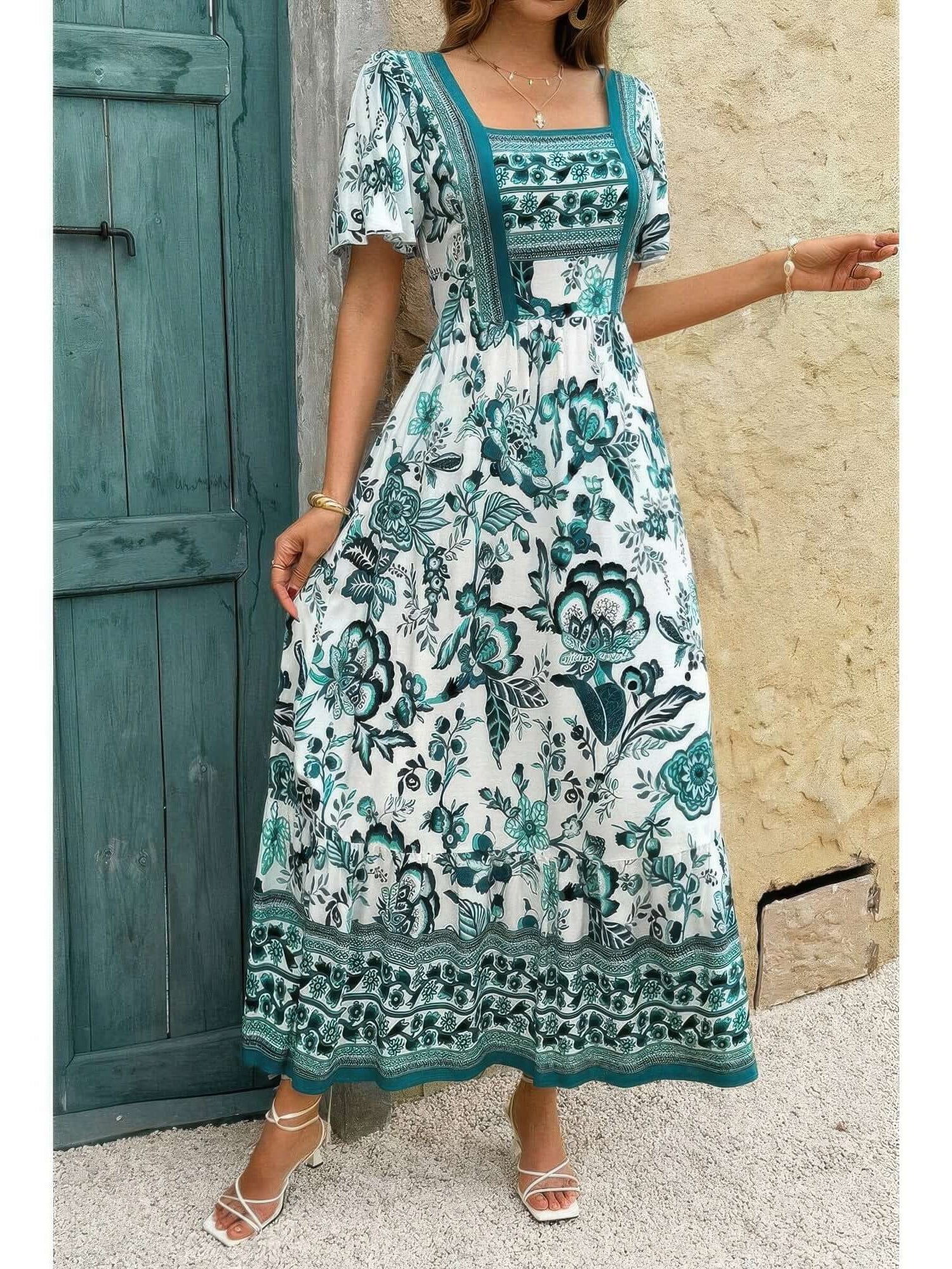 Square Neck Floral Printed Ankle Length A Line Dress showcased in teal floral print against a rustic backdrop.