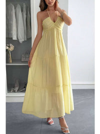 Solid Halter Muse Tiered Ruffle Long Dress in soft yellow with flowy layers and halter neckline, perfect for elegant occasions.