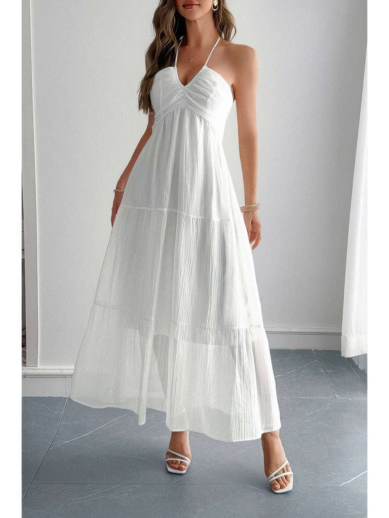 Solid Halter Muse Tiered Ruffle Long Dress in white with flowy ruffled layers and a halter neckline.