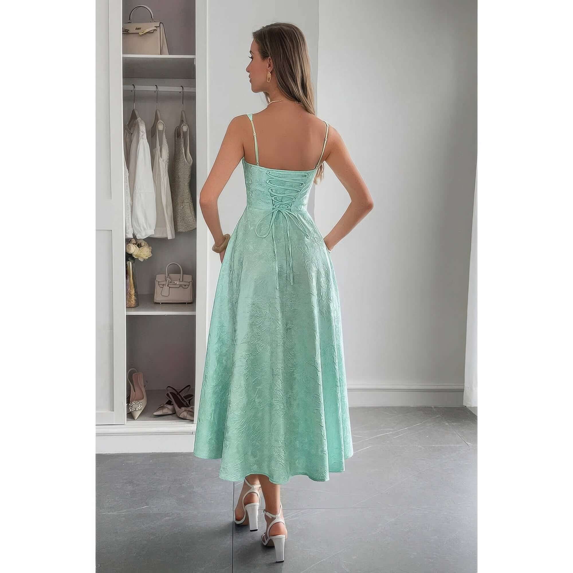 Woman wearing a Solid Floral Jacquard Lace High Waist Dress in mint green, showcasing the elegant back design.