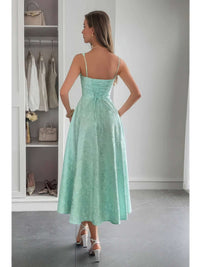 Woman wearing a Solid Floral Jacquard Lace High Waist Dress in mint green, showcasing the elegant back design.