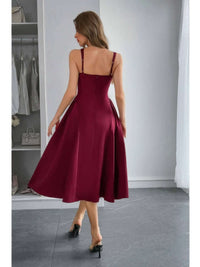 Back view of a model wearing the Square Neck A Line Pleated Sleeveless Long Dress in burgundy, showcasing its elegant flow.