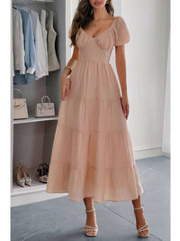 Solid Backless Tiered Puff Sleeve Fit Midi Dress in soft pink with elegant puff sleeves and a flowing tiered skirt.