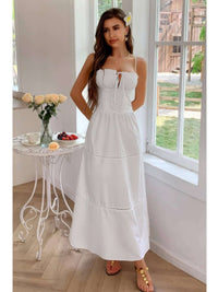 Solid Button Decor Pintuck Eyelet Shirred Dress worn by a model in a bright room with a floral backdrop.