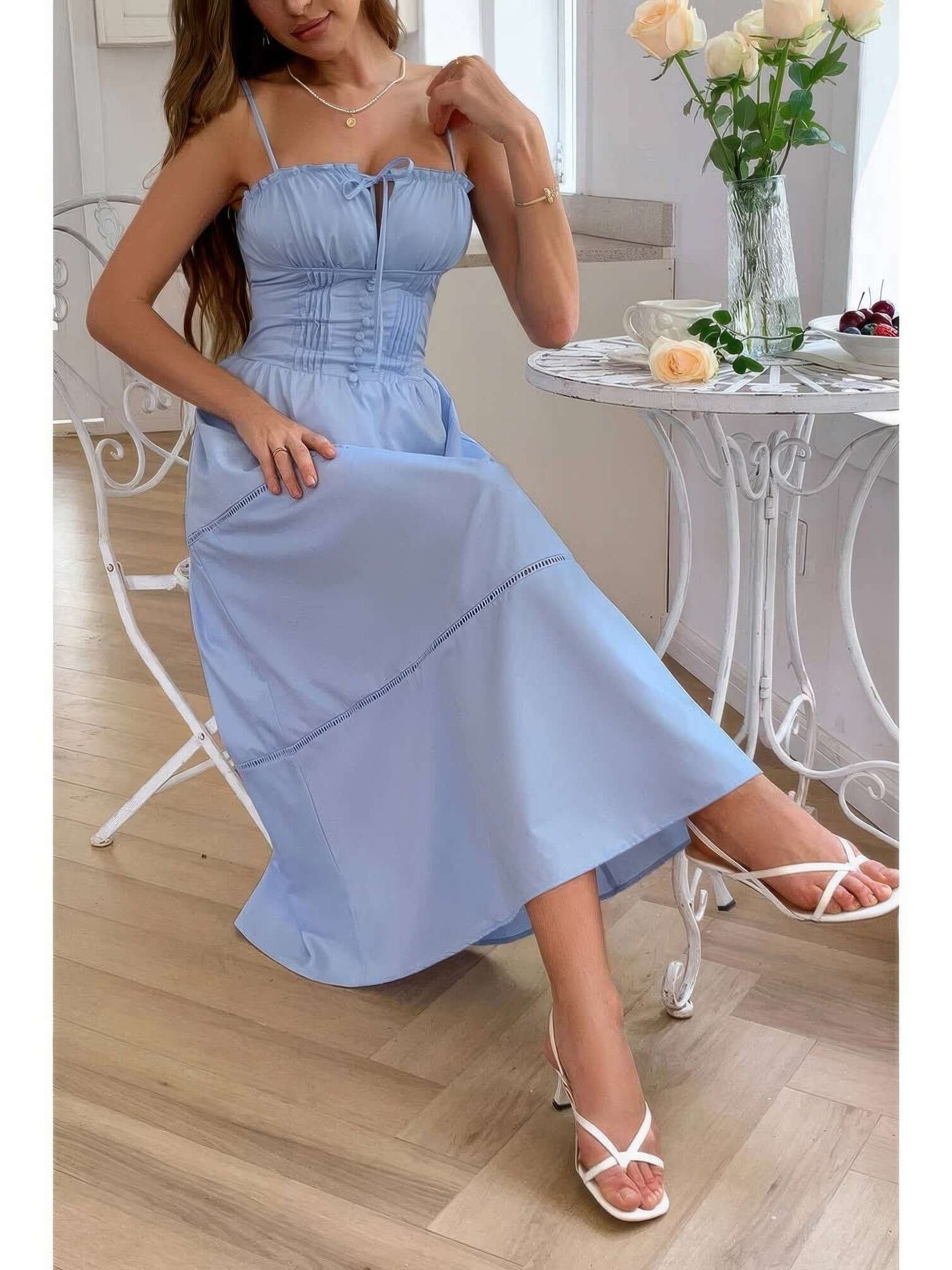 Solid Button Decor Pintuck Eyelet Shirred Dress worn by a model in a light blue color, showcasing feminine style and elegance.