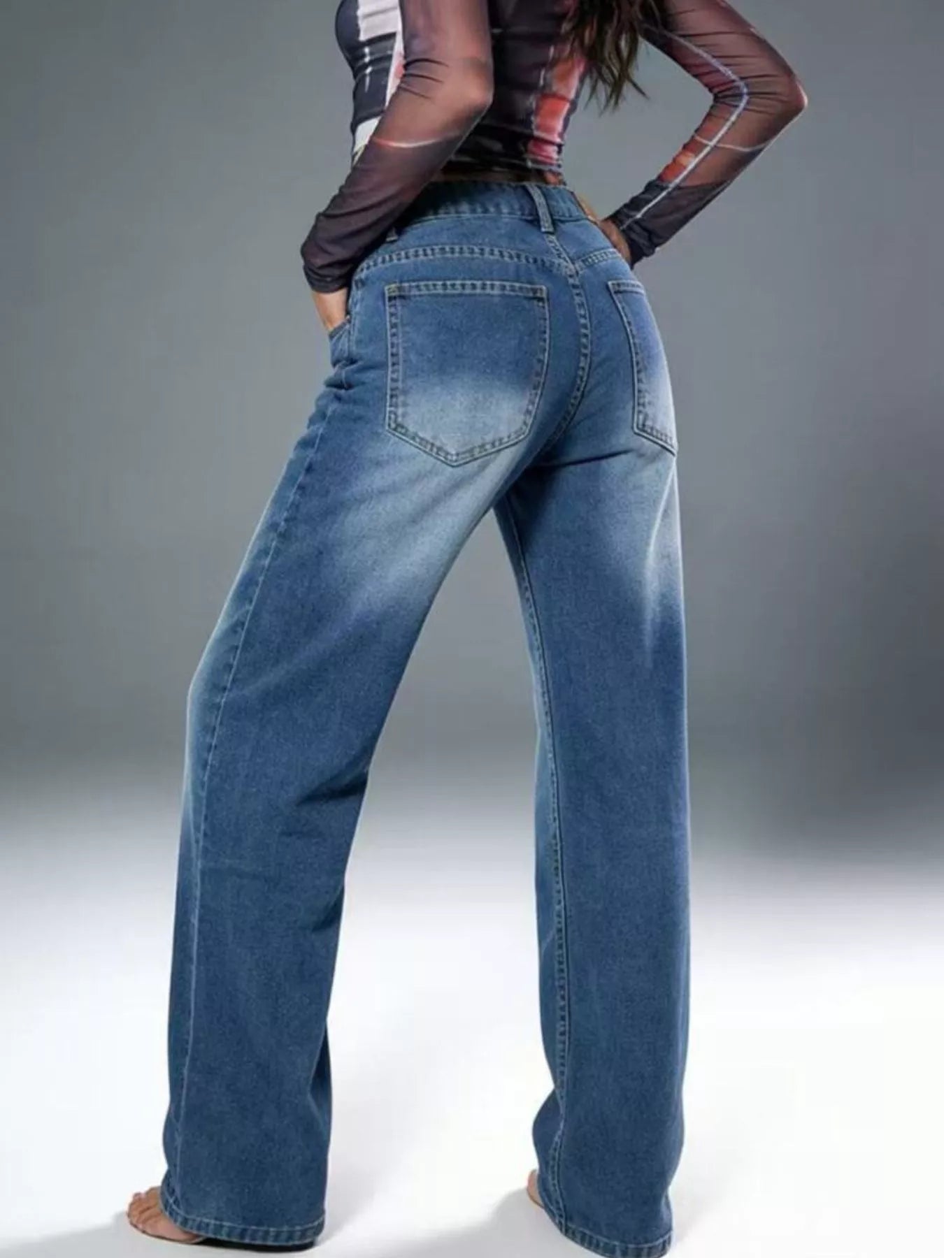 Vintage Wash Wide Leg Jeans featuring a stylish back view with a relaxed fit and classic pocket details.