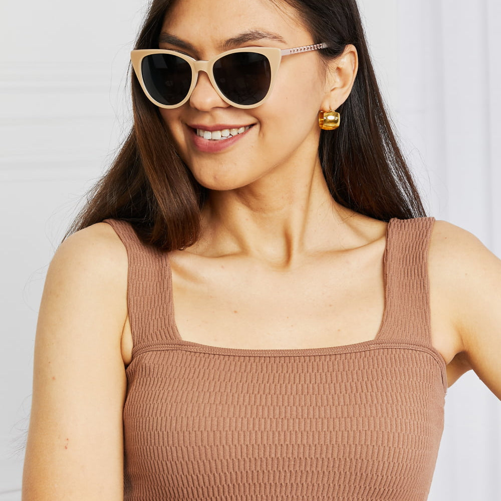 Cat-Eye Acetate Frame Sunglasses worn by a woman, showcasing stylish design and modern fashion.