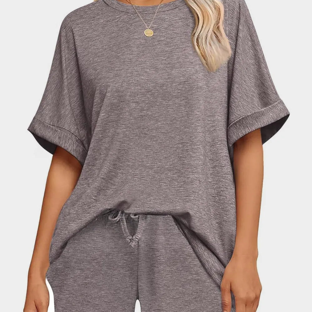 Round Neck T-Shirt and Drawstring Shorts Set modeled in gray with a relaxed fit and drawstring detail.