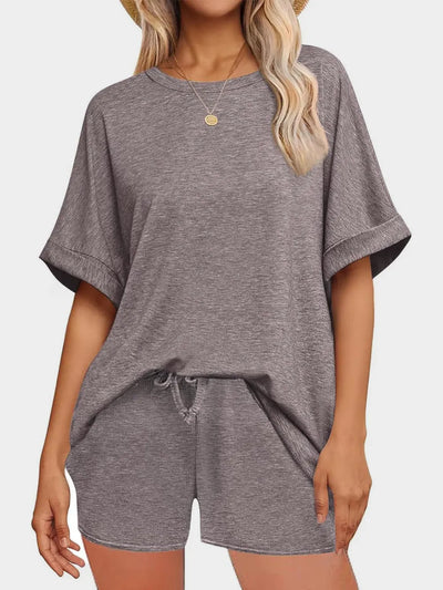 Round Neck T-Shirt and Drawstring Shorts Set modeled in gray with a relaxed fit and drawstring detail.