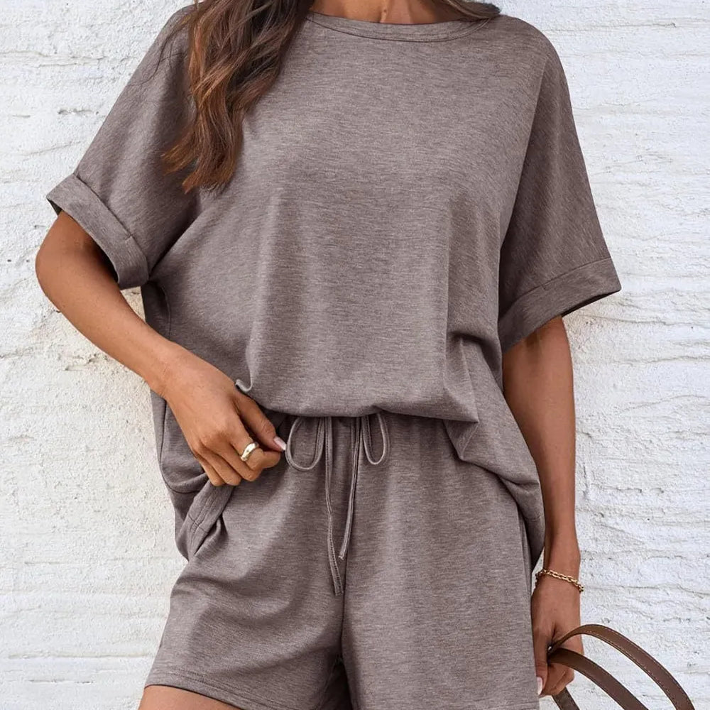 Round Neck T-Shirt and Drawstring Shorts Set on a model styled with a casual look against a textured background.