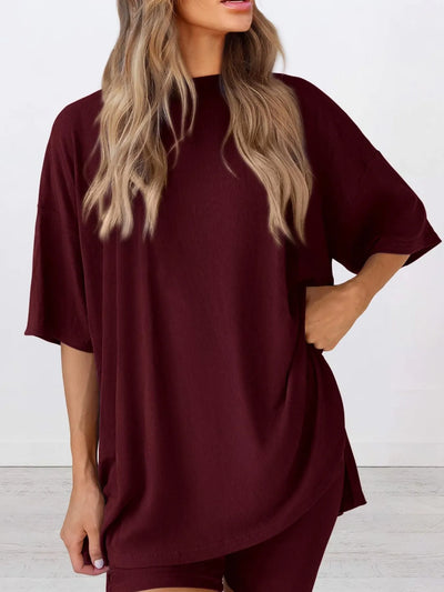 Full Size Oversized Slit Round Neck Top and Shorts Lounge Set Plus Size in burgundy worn by model.