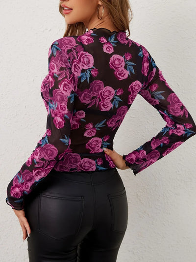 Floral Mock Neck Long Sleeve Top featuring sheer fabric and vibrant pink roses on a black background.