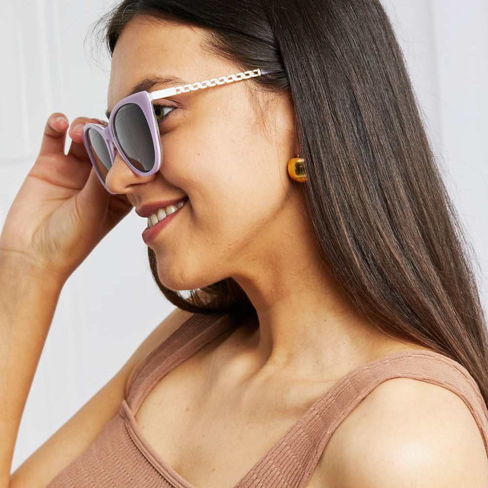 Woman wearing Cat-Eye Acetate Frame Sunglasses with stylish design and metal accents.