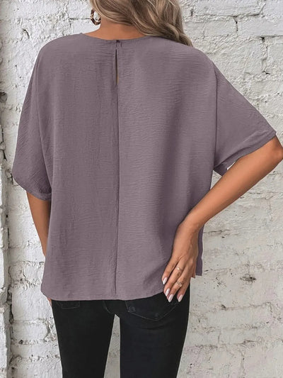 Knotted Round Neck Half Sleeve Blouse shown from the back, featuring a unique split detail at the back and relaxed fit.