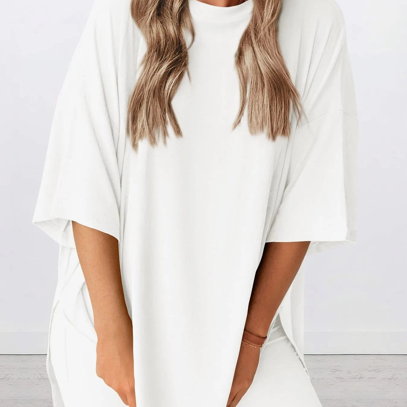 Full Size Oversized Slit Round Neck Top and Shorts Lounge Set Plus Size in white color on a model.