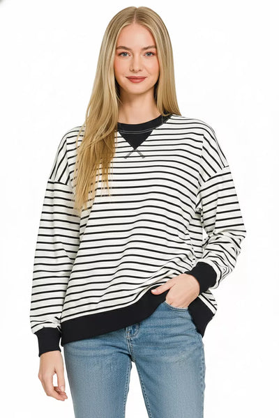 Zenana Contrast Striped Round Neck Sweatshirt in black and white stripes, featuring a sporty design and round neck.