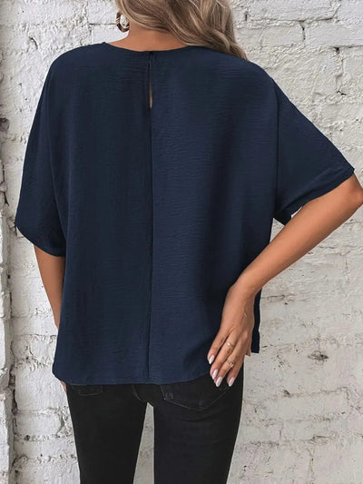 Knotted Round Neck Half Sleeve Blouse showcasing navy color with a back keyhole detail, displayed on a model.