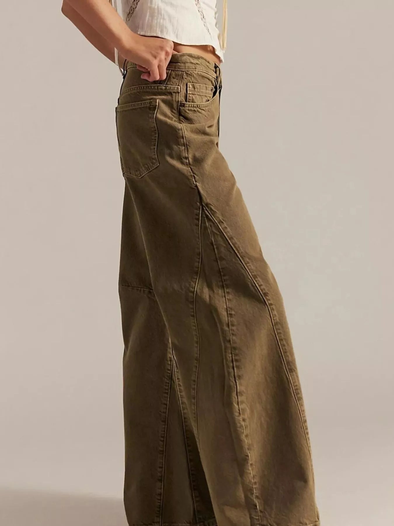 Side view of Washed Wide Leg Jeans in a relaxed fit, showcasing a pocketed design and wide leg style.