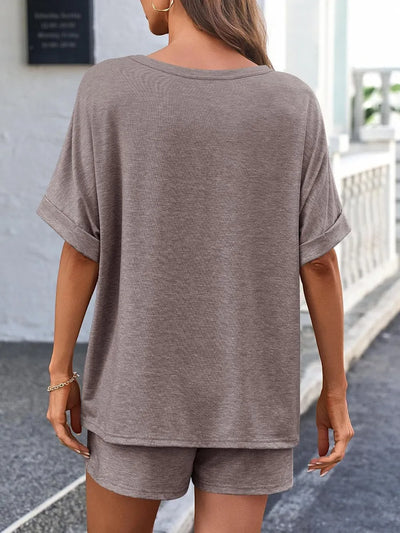 Back view of a model wearing a Round Neck T-Shirt and Drawstring Shorts Set in a stylish setting.