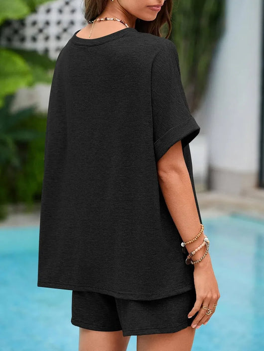 Back view of a woman wearing a Round Neck T-Shirt and Drawstring Shorts Set by the pool.