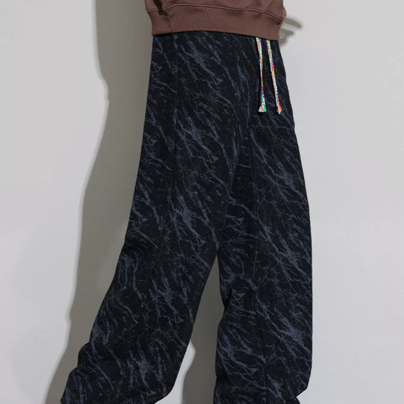 Men's Wide Leg Casual Pants featuring a stylish drawstring design and trendy pattern, perfect for casual wear.