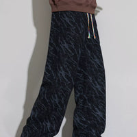 Men's Wide Leg Casual Pants featuring a stylish drawstring design and trendy pattern, perfect for casual wear.