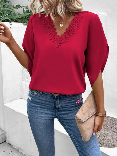 Lace Detail V-Neck Half Sleeve Blouse in red worn with jeans and clutch, showcasing elegant lace detailing.