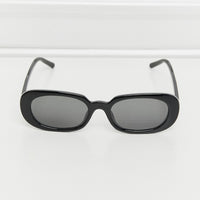 Oval Full Rim Sunglasses with black lenses in a sleek design on a white background.