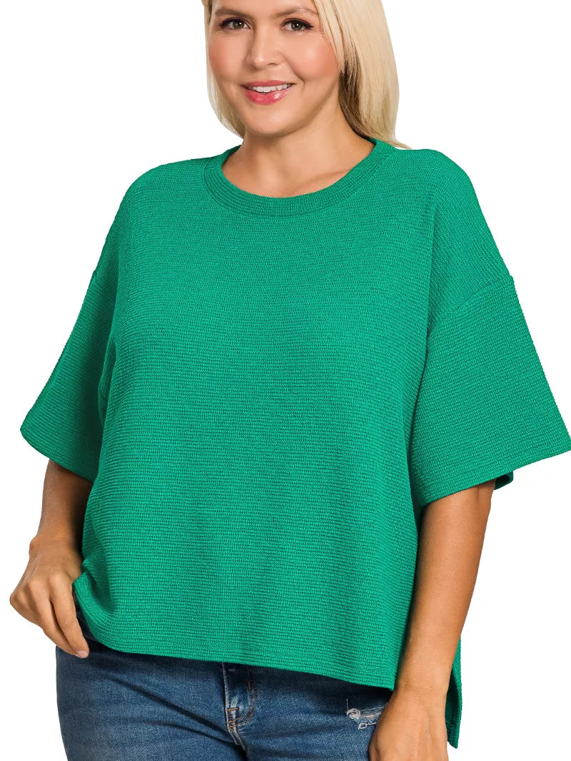 Zenana Full Size Double Knit Side Slits Hi Low Short Sleeve Top Plus Size in vibrant green worn by a model.