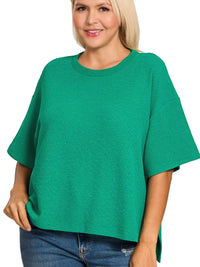 Zenana Full Size Double Knit Side Slits Hi Low Short Sleeve Top Plus Size in vibrant green worn by a model.