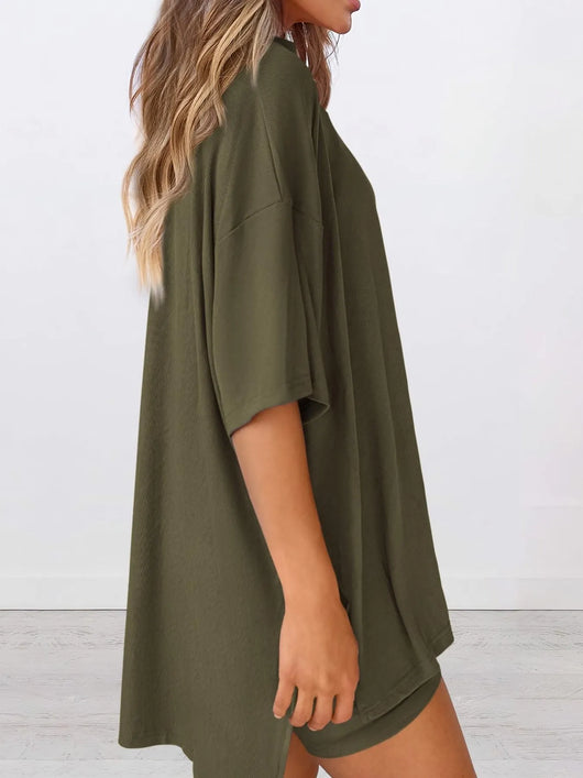Full Size Oversized Slit Round Neck Top and Shorts Lounge Set Plus Size model wearing olive green oversized top at side view