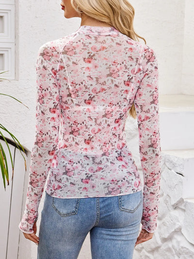 Floral Mock Neck Long Sleeve Top displayed from the back, featuring a floral design and slightly stretchy fabric.