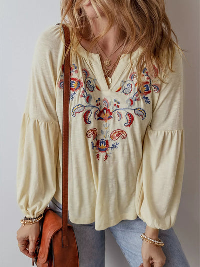 Embroidered Notched Balloon Sleeve Blouse worn by a woman, featuring floral embroidery and balloon sleeves.