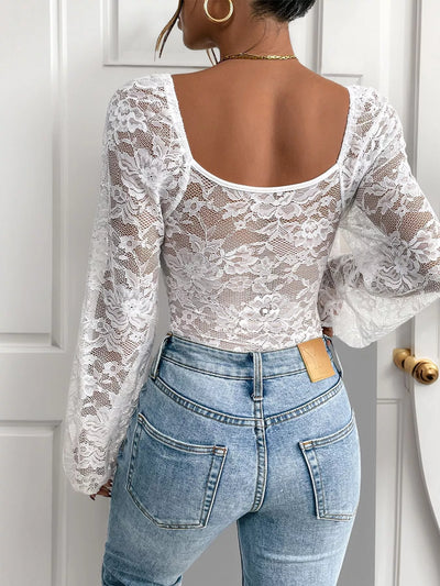 Lace Long Sleeve Bodysuit featuring a stylish back and bell sleeves, paired with high-waisted jeans.