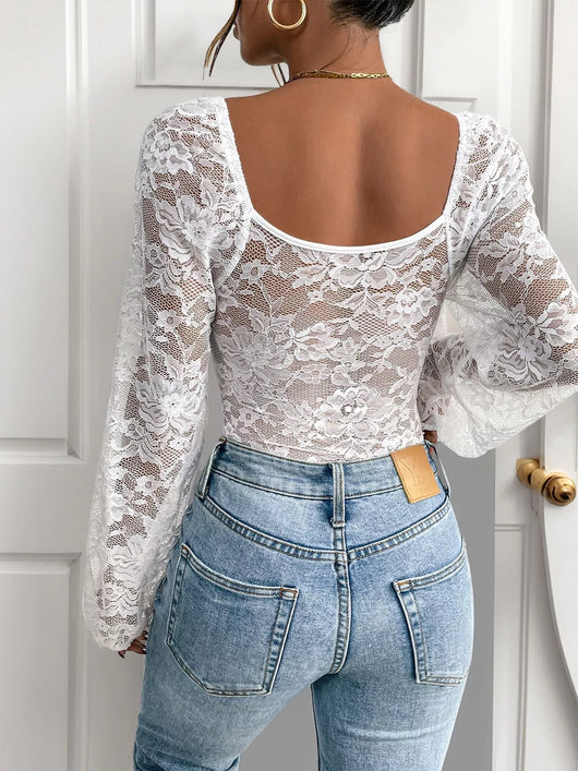 Lace Long Sleeve Bodysuit featuring a stylish back and bell sleeves, paired with high-waisted jeans.