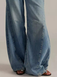 Washed Wide Leg Jeans showcasing a relaxed, loose fit with a light blue denim color and wide leg silhouette.