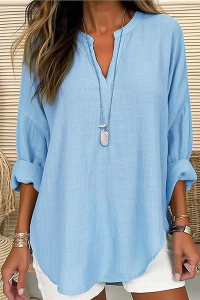 Solid Color Notched Long Sleeve Blouse in light blue, featuring a collar and rolled-up sleeves, styled with jewelry.