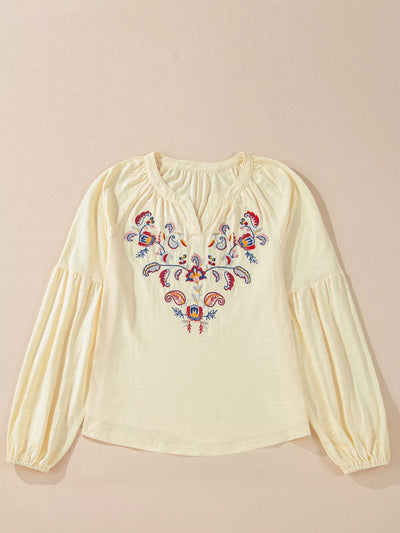 Embroidered Notched Balloon Sleeve Blouse featuring colorful embroidery on a soft, light fabric.