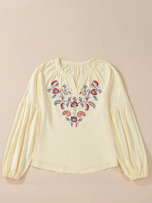 Embroidered Notched Balloon Sleeve Blouse featuring colorful embroidery on a soft, light fabric.