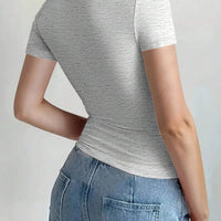 Round Neck Short Sleeve T-Shirt back view on a model, showcasing the fit and style.