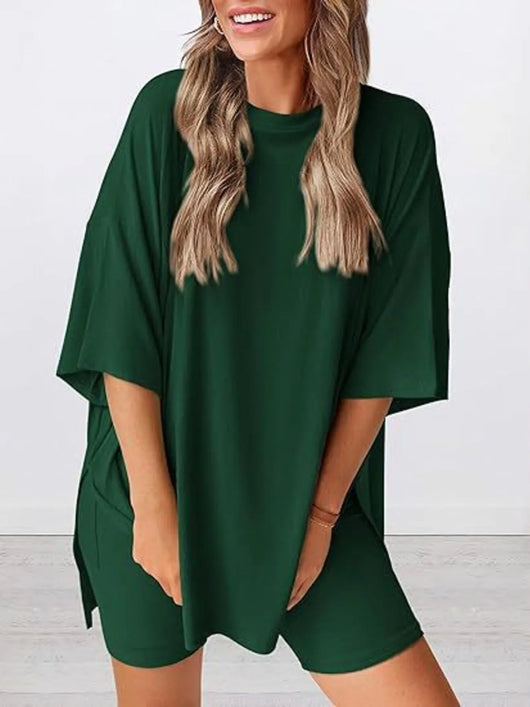 Full Size Oversized Slit Round Neck Top and Shorts Lounge Set Plus Size in dark green on a model.